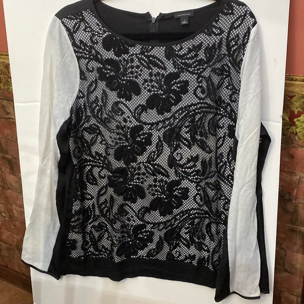 Gently used Ann Taylor sweater with rayon material in back with zipper in large